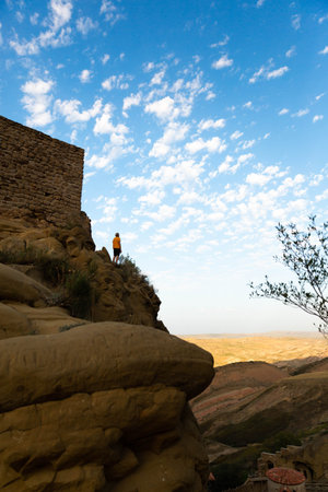 Man standing alone at mountains Looking at sky Travel Lifestyle spiritual relaxation vacations...