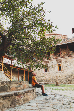 Man sitting alone relaxing under the tree Looking up Thinking