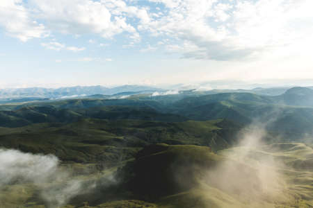 Cloudy foggy mountains green valley landscape Travel Lifestyle concept adventure vacations outdoorの写真素材