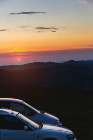 Two car parking in the mountains Early in the morning Sunrise Adventures tourismの写真素材