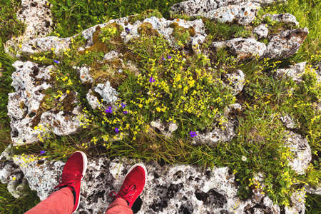 Feet Selfie red sport shoes Traveler standingon stone outdoor Lifestyle hiking Travel concept summer vacationsの写真素材