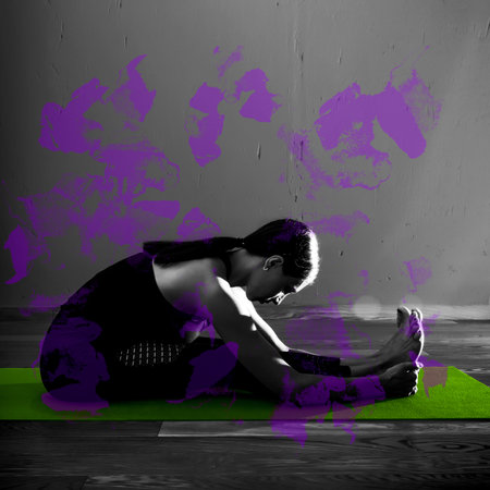 Black white photo of Young beautiful woman brunette in black clothes practice yoga in dark studio...