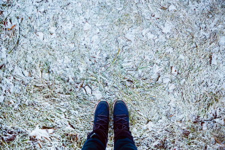 Foot Selfie in boots. First snow. Winter Coldlyの写真素材