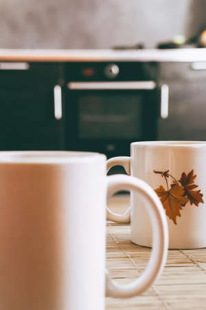 Two vintage cups with tea on the table. Home life. Morning lightの写真素材