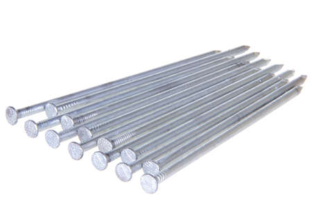 The group of steel nails lying on a white isolated backgroundの写真素材