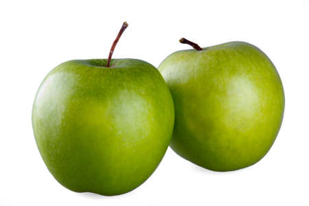 Two green apples on a white isolated backgrondの写真素材