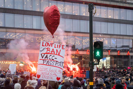 Stockholm, Sweden, January 22 2021: Sign reading Love LIife Ban Vacc Passport during anti vaccine passport rally protestのeditorial素材
