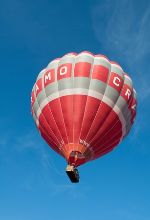 HELSINKI, FINLAND - 11 SEPTEMBER 2017: Red balloon flying in skies over the Marine park during the annual aeronautical festivalのeditorial素材