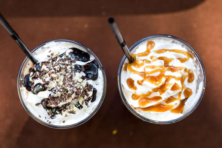 Summer cocktails with ice cream on wooden tableの写真素材