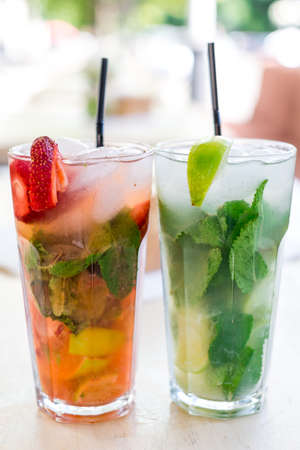 Fresh mojito drink with ice and fruitの写真素材