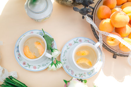 beautiful fresh cold peach tea with ripe peachesの写真素材