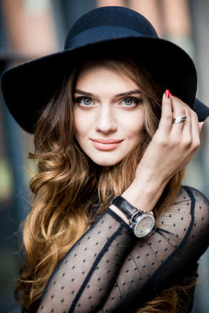 beautiful stylish young woman (girl) in dress and hatの写真素材