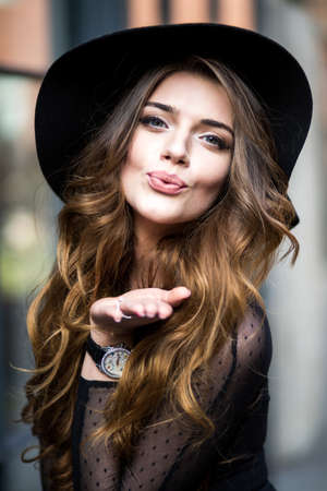 beautiful stylish young woman (girl) in dress and hatの写真素材