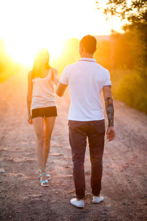 A man and a girl with a tattoo on the natureの写真素材