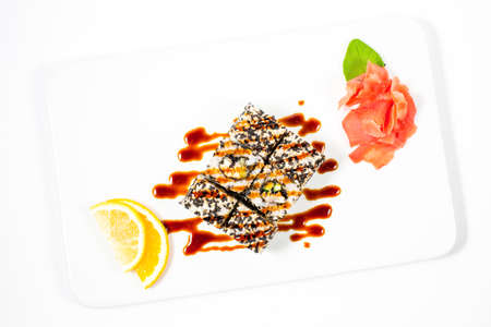 Salmon and caviar rolls served on a plateの写真素材