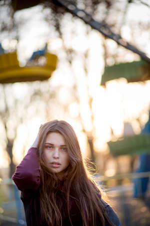 Portrait of beautiful young brunette girl in the Parkの写真素材