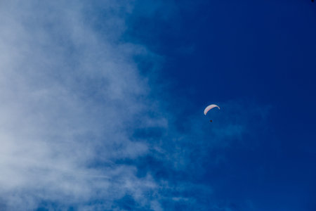 Beautiful blue skies with clouds over the mountainsの写真素材
