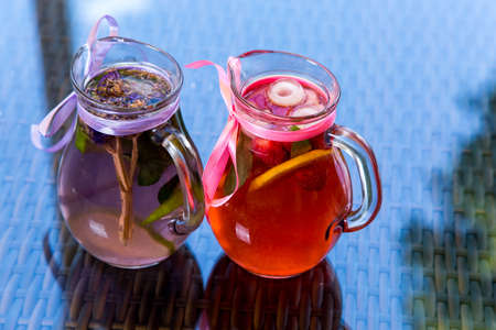 fresh Cocktail juice with mint and ice on table. Healthy organic drinks. Fresh mojito drink with ice and fruitの写真素材