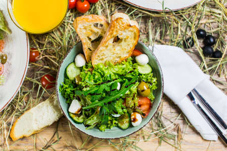 Beautiful fresh salad with rocket, croutons and Parmesan cheeseの写真素材