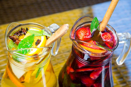 fresh Cocktail juice with mint and ice on table. Healthy organic drinks. Fresh mojito drink with ice and fruitの写真素材