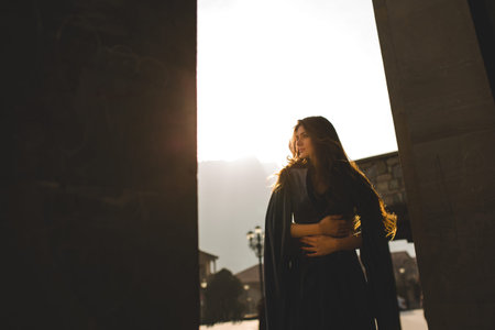 beautiful young Georgian girl near old castle