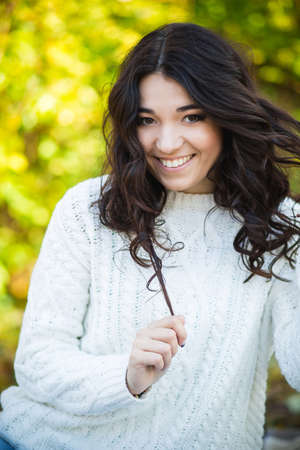 Beautiful girl portrait, outdoor on nature in  sunny day backgroundの写真素材