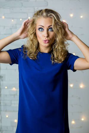 Beautiful sexy young blonde girl model with makeup and perfect bodyの写真素材