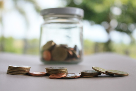 Coins in glass bottlesの写真素材