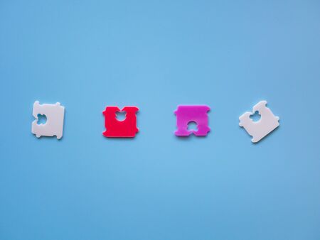 Price Tag Bread Clip and blue background. The color of plastic tags on bread bag use to tell you which day of the week bread was baked on.の写真素材
