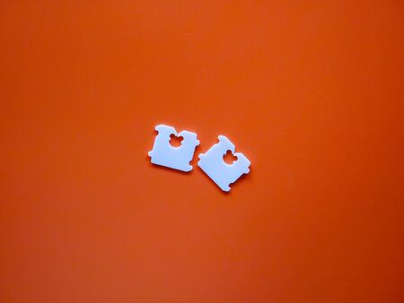 Price Tag Bread Clip on brown background. The color of plastic tags on bread bag use to tell you which day of the week bread was baked on.の写真素材