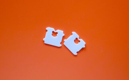 Price Tag Bread Clip on brown background. The color of plastic tags on bread bag use to tell you which day of the week bread was baked on.の写真素材
