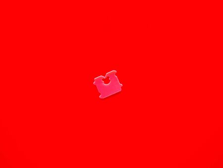 Price Tag Bread Clip and red background. The color of plastic tags on bread bag use to tell you which day of the week bread was bakedの写真素材