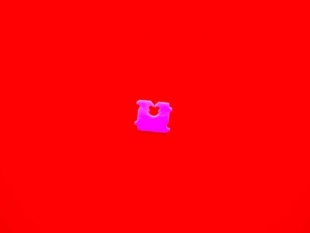 Price Tag Bread Clip and red background. The color of plastic tags on bread bag use to tell you which day of the week bread was bakedの写真素材