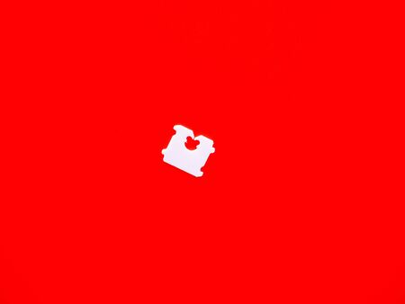 Price Tag Bread Clip and red background. The color of plastic tags on bread bag use to tell you which day of the week bread was bakedの写真素材