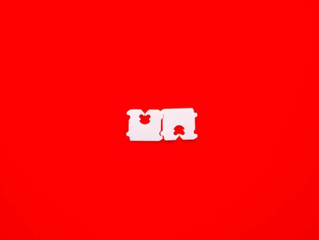 Price Tag Bread Clip and red background. The color of plastic tags on bread bag use to tell you which day of the week bread was bakedの写真素材