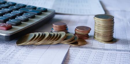 Business Finance and Money concept, Money coin stack growing graph with blue backgroundの写真素材