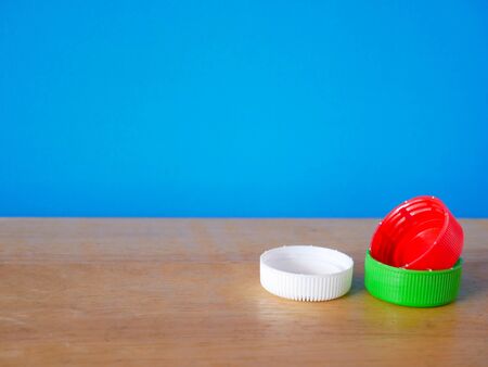 bottle caps on blue backgroundの写真素材