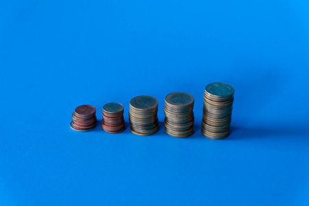 stack coin on blue background, money coins