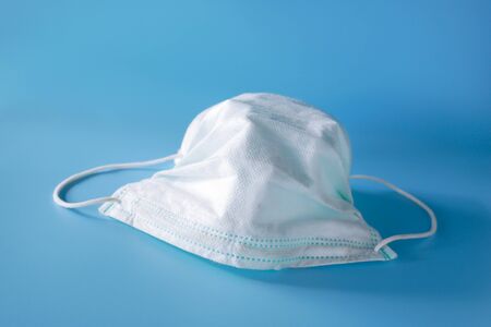 used surgical mask in clinic. discarded mask. The mask that was discarded after the virus spread.の写真素材