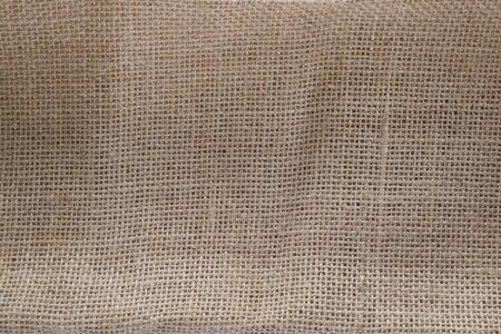Burlap on wood for backgroundの写真素材