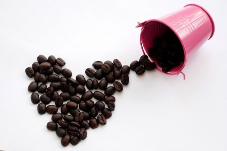 organic aroma coffee beans on white background. coffee bucketの写真素材