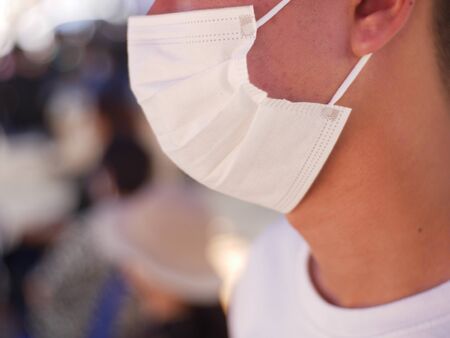 Doctor wearing protection face mask against coronavirus.の写真素材