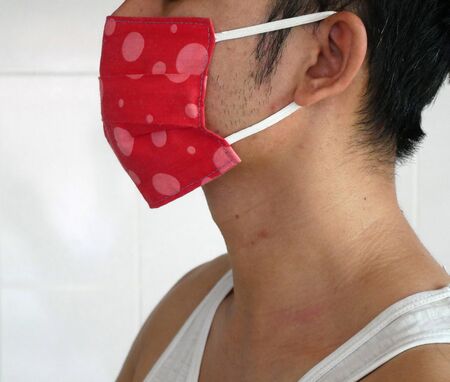 Doctor wearing protection face mask against coronavirus.の写真素材