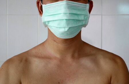 Doctor wearing protection face mask against coronavirus.の写真素材