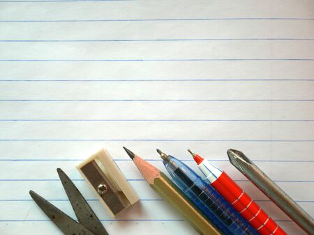 Pen and pencil sharpener on white paper backgroundの写真素材