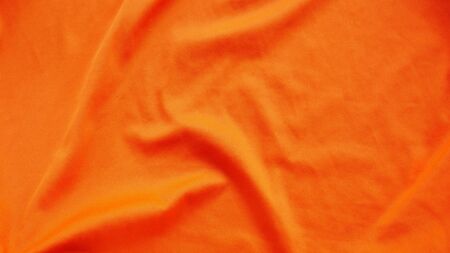 orange silk satin texture, cotton fabric backgroundの写真素材