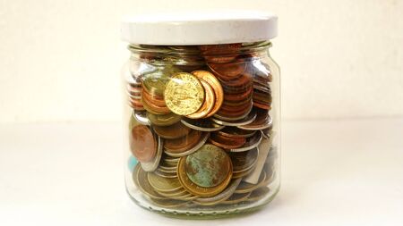 coins in a glass jar concept save moneyの写真素材