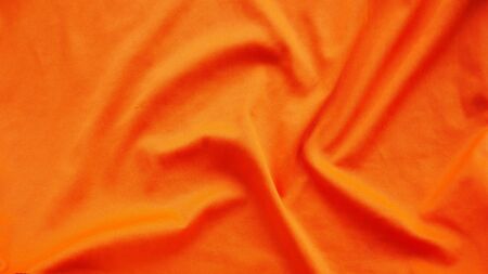 orange silk satin texture, cotton fabric backgroundの写真素材
