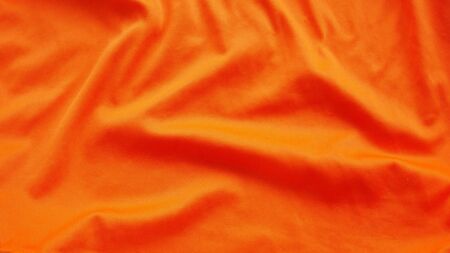 orange silk satin texture, cotton fabric backgroundの写真素材