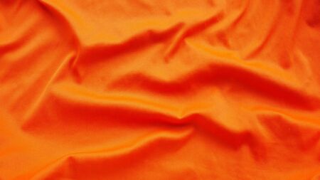 orange silk satin texture, cotton fabric backgroundの写真素材